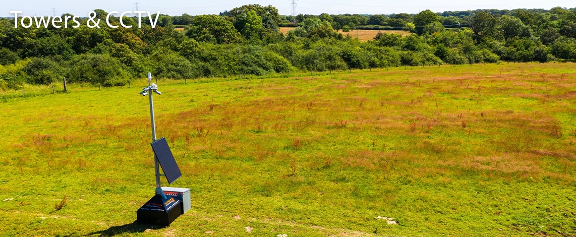 A D-TECT CCTV tower set up in a grassy open area