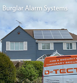 A house with a D-TECT intruder alarm siren and CCTV cameras